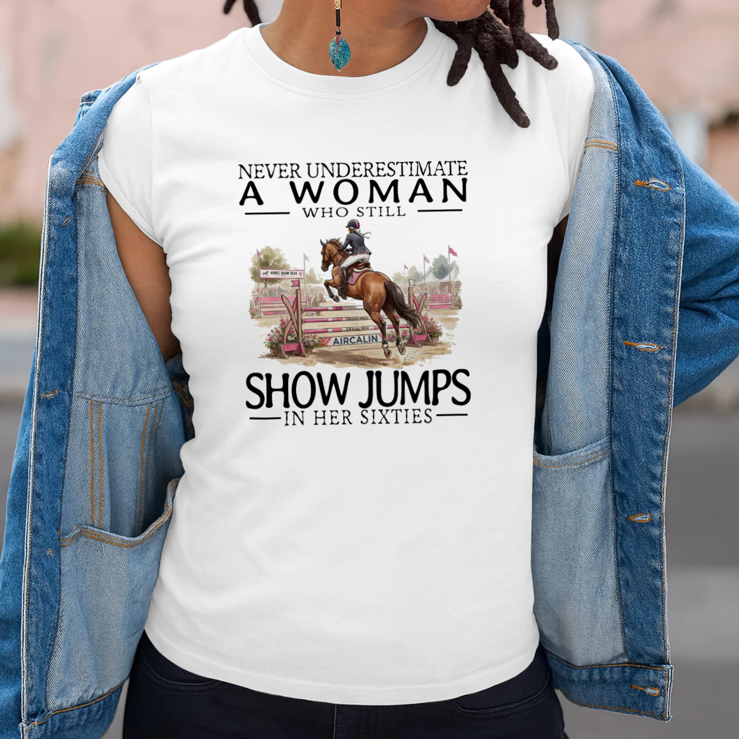 NEVER UNDERESTIMATE A WOMA WHO STILL SHOW JUMPS IN HER SIXTIES