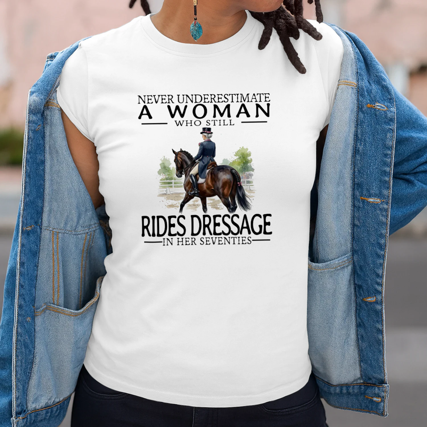NEVER UNDERESTIMATE A WOMAN WHO STILL RIDES DRESSAGI IN HER SEVENTIES