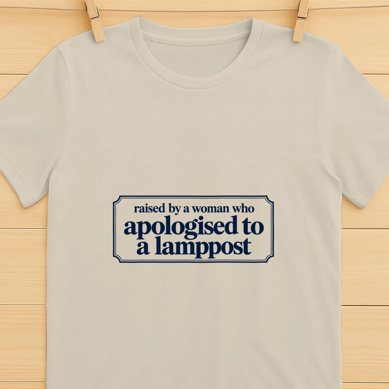 Raised by a Woman Who Apologised to a Lamppost T-Shirt